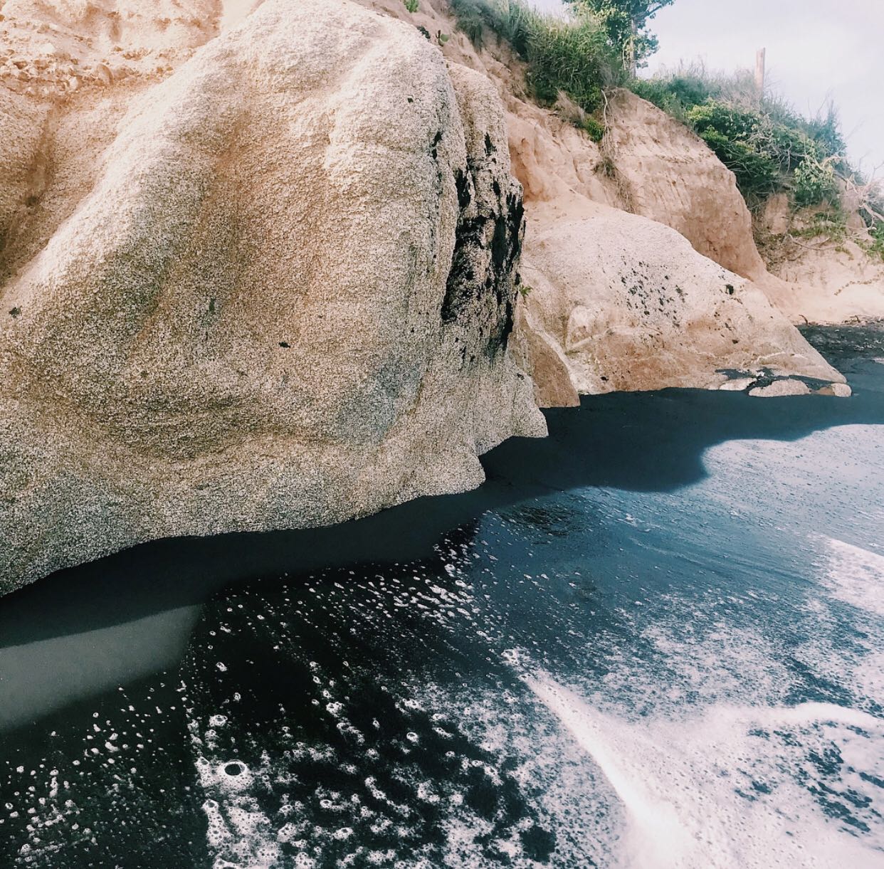 The black sand happens in Vieques when rich and amazing volcanic material from Monta Pirata is washed down through a quebrada (stream) during the rains. Monta Pirata is the highest point on Vieques. Playa Negra, Vieques